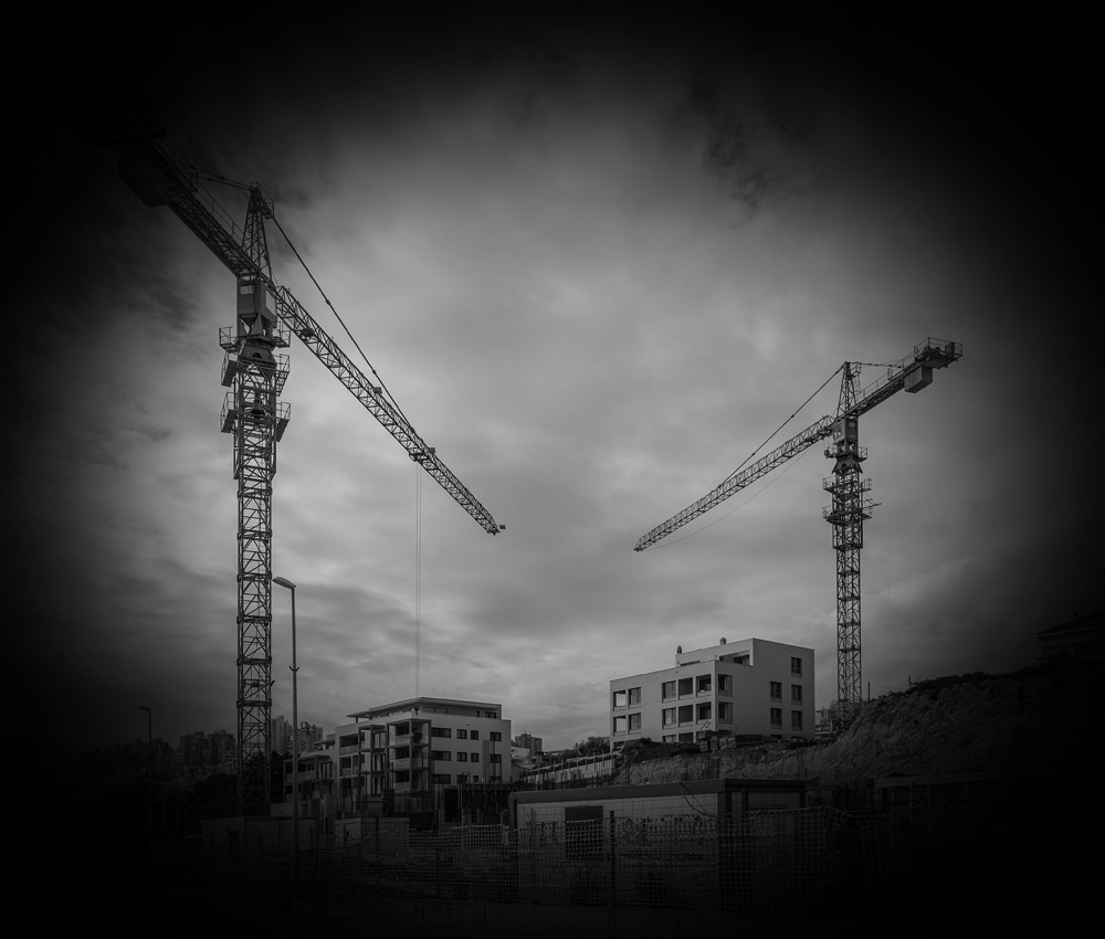 construction health and safety cranes worksite black and white